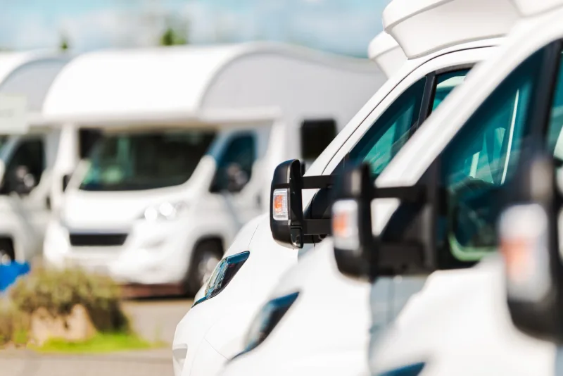 RV Campers For Sale in the RV Dealership. Brand New Motorcoaches. Travel and Tourism Industry.